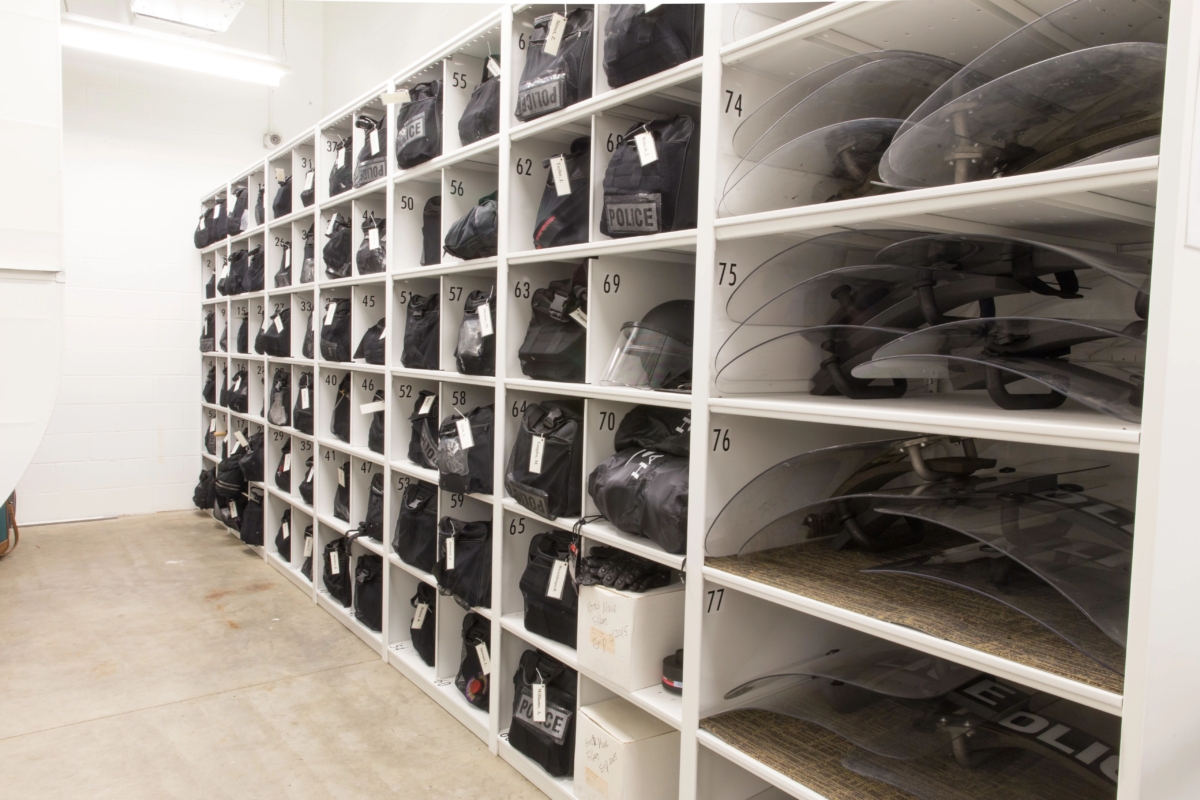 Custom bins can be labeled and stacked to store police gas masks and other equipment.