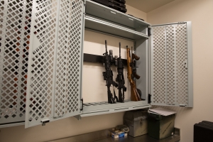 Universal™ Weapons Racks with perforated lockable doors store weapons in the SWAT room.