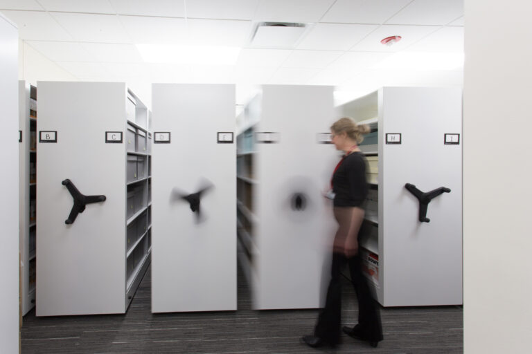 Reduce permanent aisles to free up space for additional shelves, bins, or file drawers.